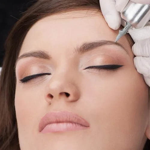 Cosmetic tattoo eyeliner being applied with precision at Envisage Beauty